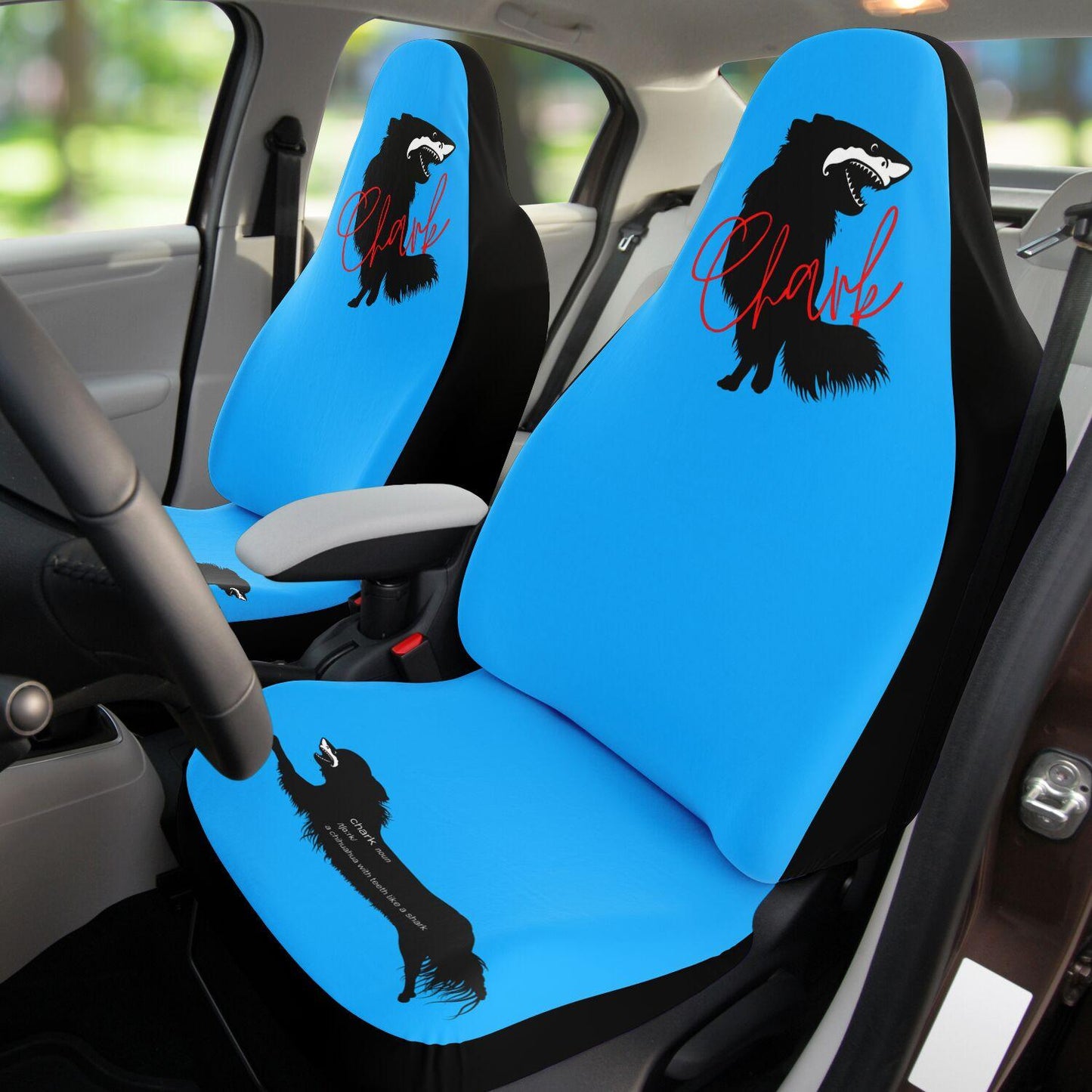 This punky pair of electric blue front car seat covers feature the silhouette of a black longhair chihuahua with the face of a great white shark - mouth open to show off jaws lined with sharp teeth. The word "Chark" is artfully placed in red cursive font over the image. The seat fronts feature another shark-faced chihuahua, and a "dictionary entry" of the noun "chark": a chihuahua with teeth like a shark. Design by Renate Kriegler for Chimigos.