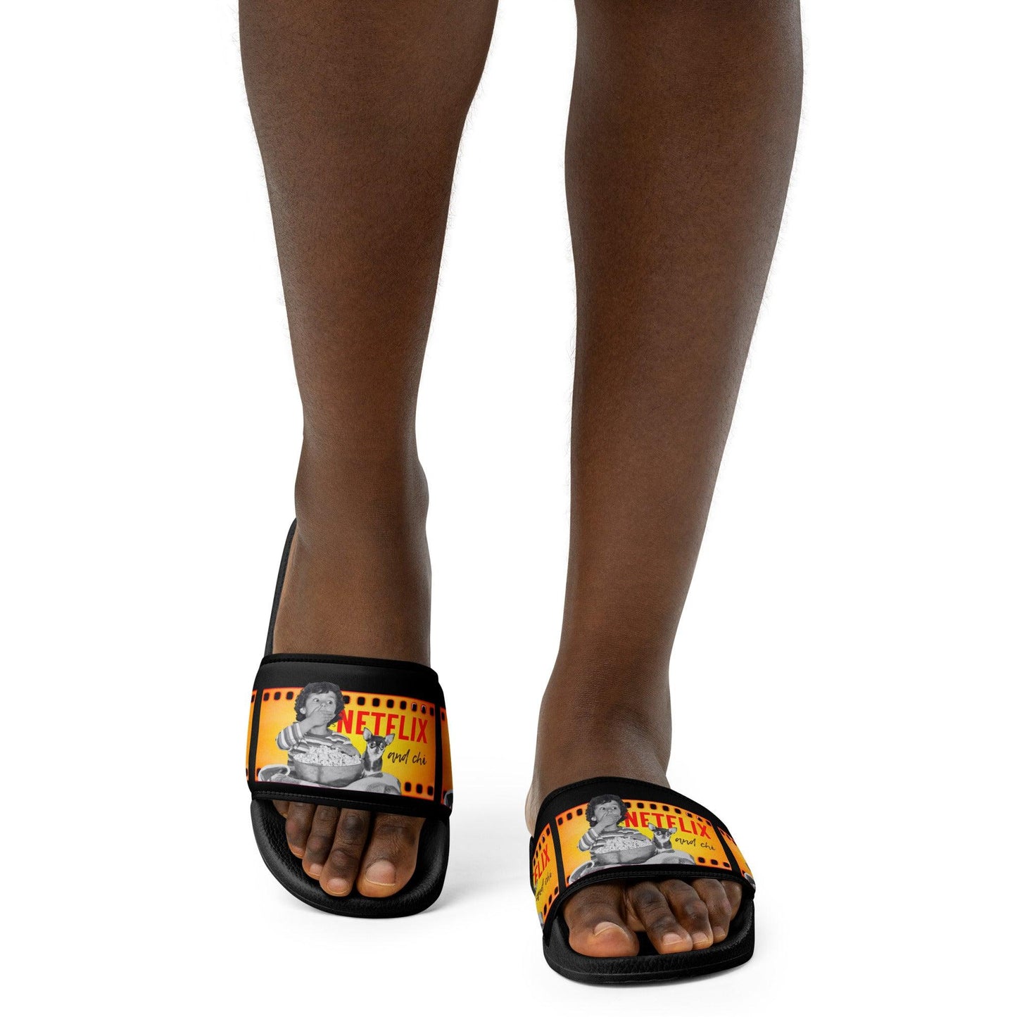 What's better than Netflix and Chill? Netflix and CHI! If your Netflix and Chill sofa buddy is a chihuahua, these cool Netflix and Chi women's slides are for you. Or a brilliant gift for a chihuahua mum. The faux leather straps feature a boy and his chihuahua pal watching a scary movie together, and the words "Netflix and Chi" against a black background. Let your weary feet chill too in the cushioned upper straps and the contoured, textured foot beds. Design by Renate Kriegler for Chimigos.