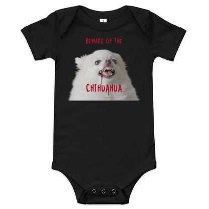 An angelic fluffy white chihuahua with bloody fangs reminds us that looks can be deceiving. Beware of the chihuahua! This black zombie chihuahua baby one piece makes a punky gift for Halloween, or as part of your matching family Halloween t-shirts. Made from 100% cotton. Short sleeves. Sizes 3-6 months, 6-12 months, 12-18 months and 18-24 months. Design by Renate Kriegler for Chimigos.