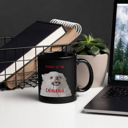 An angelic fluffy white chihuahua with bloody fangs reminds us that looks can be deceiving. BEWARE OF THE CHIHUAHUA!  This glossy black zombie chihuahua mug makes a punky gift for any Halloween enthusiast. Design by Renate Kriegler for Chimigos.
