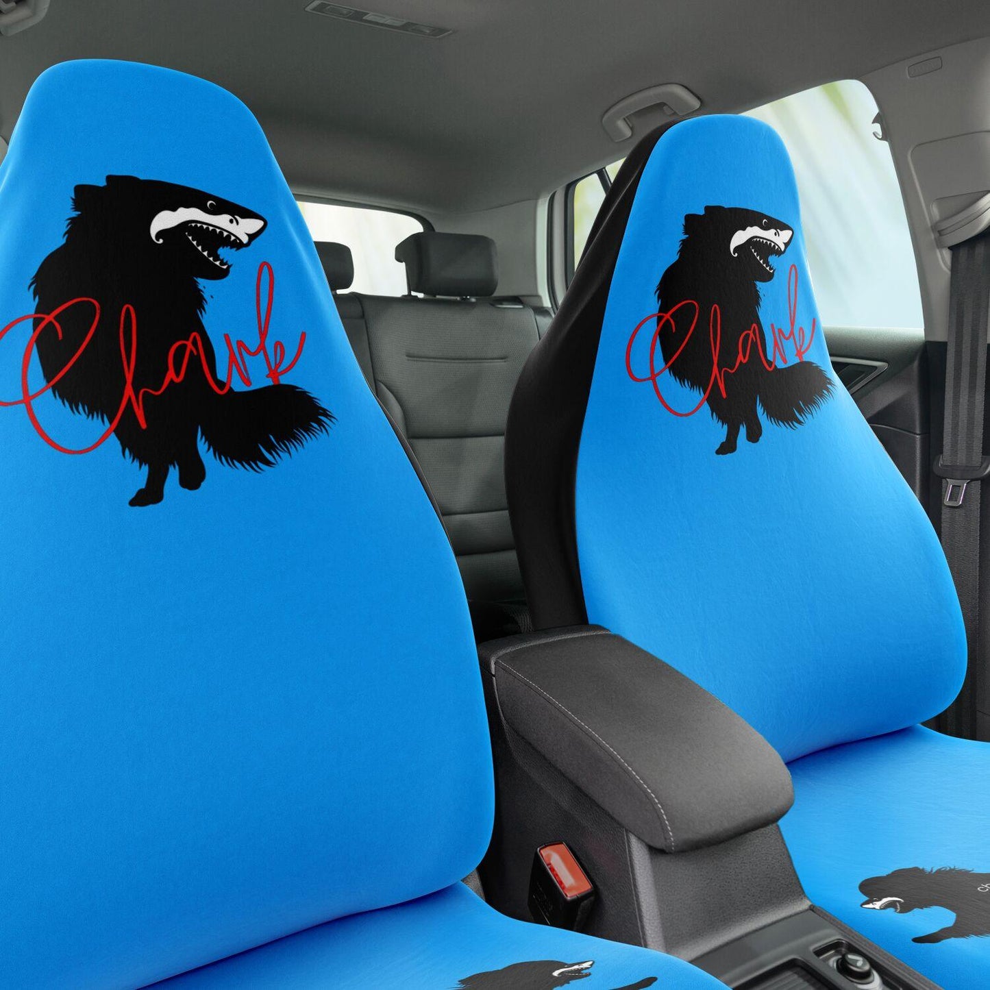 This punky pair of electric blue front car seat covers feature the silhouette of a black longhair chihuahua with the face of a great white shark - mouth open to show off jaws lined with sharp teeth. The word "Chark" is artfully placed in red cursive font over the image. The seat fronts feature another shark-faced chihuahua, and a "dictionary entry" of the noun "chark": a chihuahua with teeth like a shark. Design by Renate Kriegler for Chimigos.