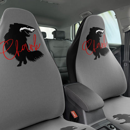 This punky pair of grey front car seat covers feature the silhouette of a black longhair chihuahua with the face of a great white shark - mouth open to show off jaws lined with sharp teeth.  The word "Chark" is artfully placed in red cursive font over the image. The seat fronts feature another shark-faced chihuahua, and a "dictionary entry" of the noun "chark": a chihuahua with teeth like a shark. Design by Renate Kriegler for Chimigos.