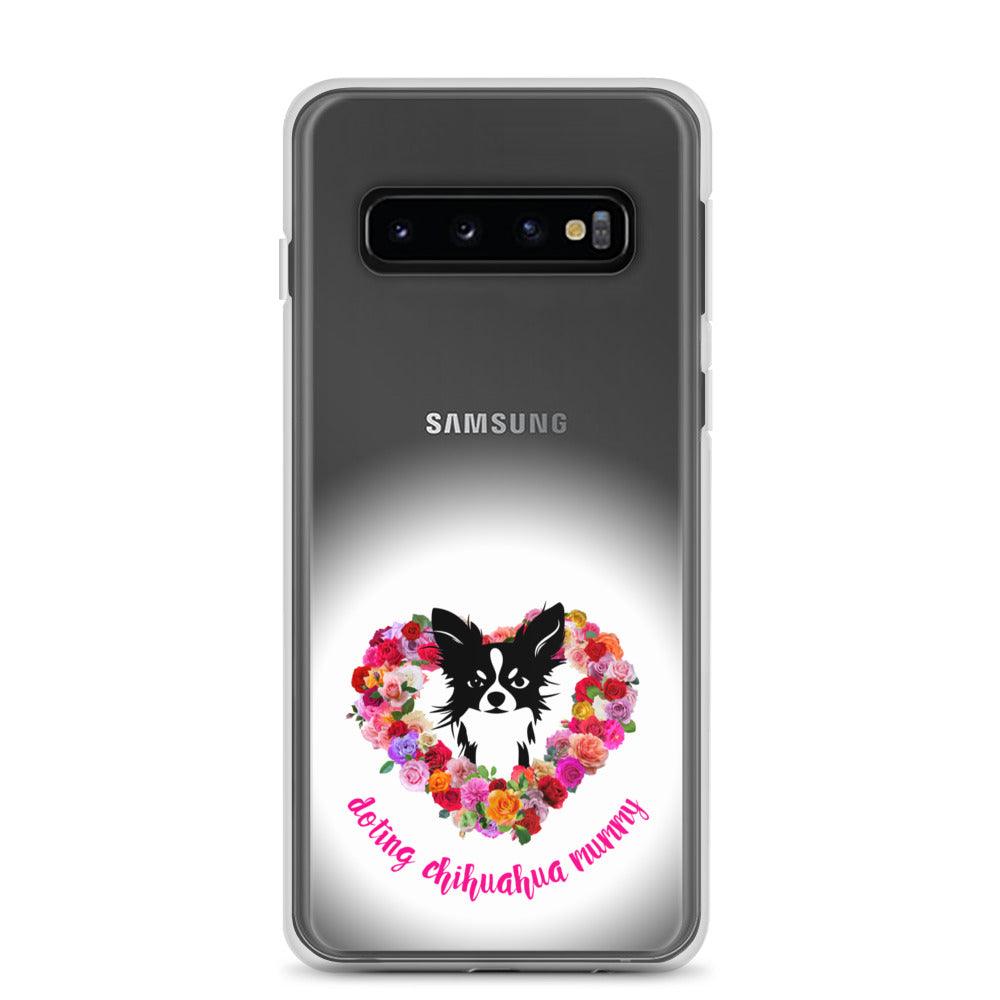 There's something so special about the bond between a girl and her chi baby. These cute little dogs charm their way deep into their mum's heart. Quality iPhone® case with solid back, flexible sides and precisely aligned port openings. The design features a black and white longhaired chihuahua surrounded by a lush heart-shaped rose garland, and the words "doting chihuahua mummy" - an adorable Mother's Day / birthday / Christmas gift for a doting chihuahua mummy. Design by Renate Kriegler for Chimigos.