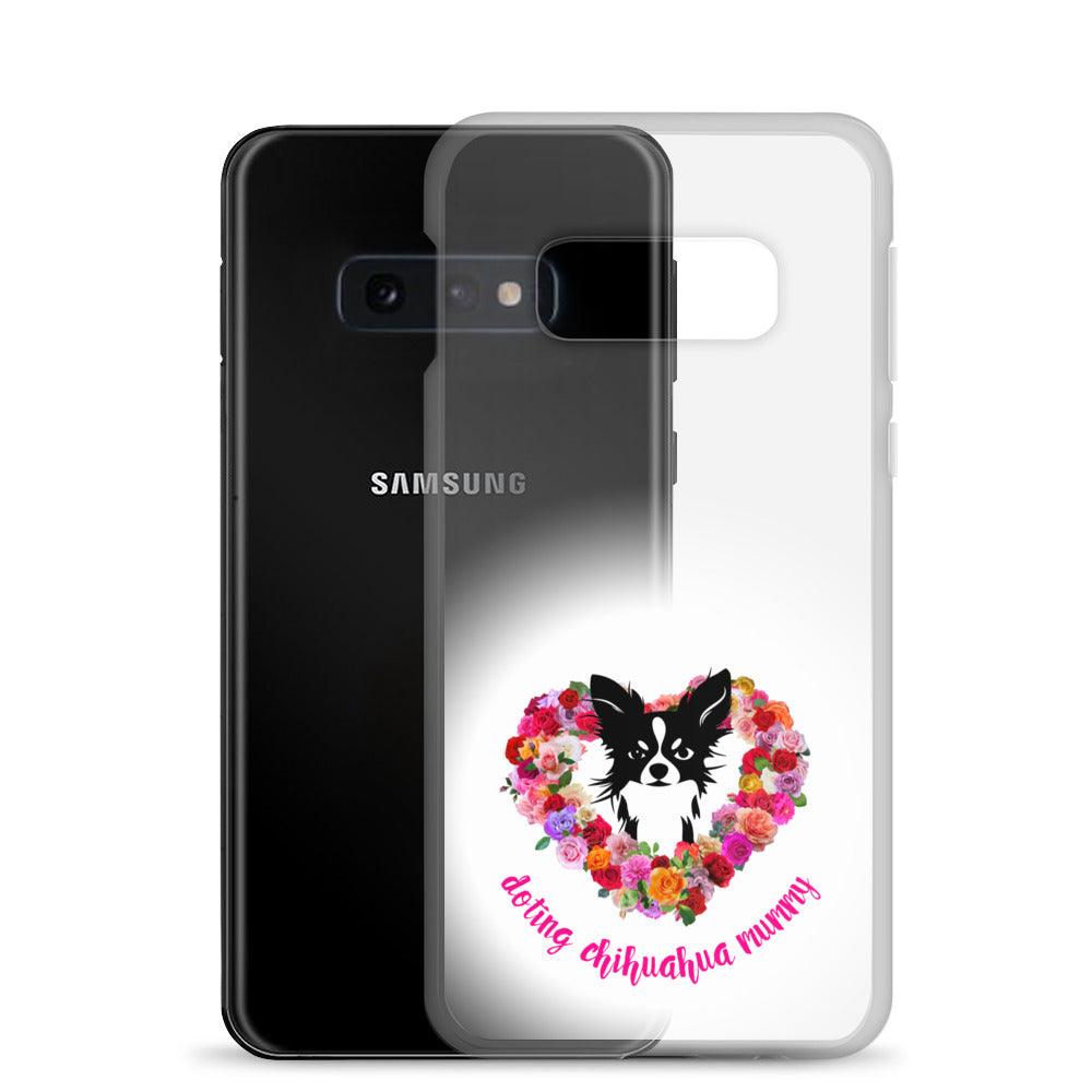 There's something so special about the bond between a girl and her chi baby. These cute little dogs charm their way deep into their mum's heart. Quality iPhone® case with solid back, flexible sides and precisely aligned port openings. The design features a black and white longhaired chihuahua surrounded by a lush heart-shaped rose garland, and the words "doting chihuahua mummy" - an adorable Mother's Day / birthday / Christmas gift for a doting chihuahua mummy. Design by Renate Kriegler for Chimigos.